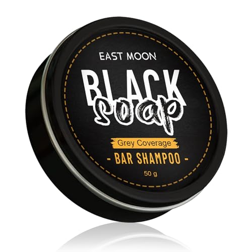 Black soap bar shampoo by East Moon, natural black soap for hair cleansing, shown as a dark soap bar on a white background.
