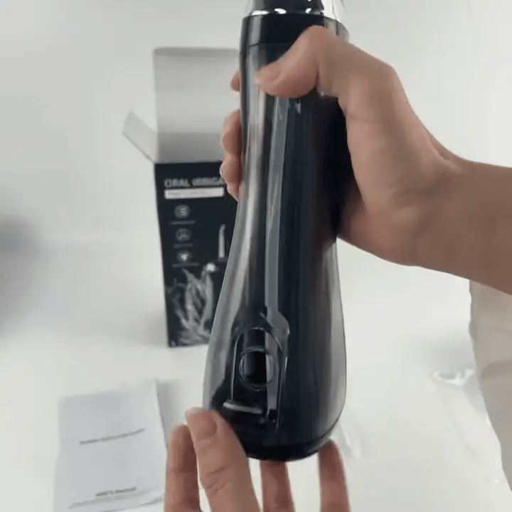 Oral irrigator from Find Your Beauty by Iqbal's Cart, showing a compact device with a water spray nozzle for dental cleaning.