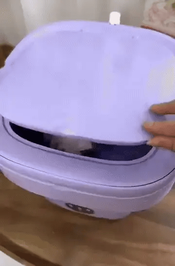 Foldable mini laundry machine by Bloom Mart, compact design with a foldable frame for easy storage and efficient laundry at home.