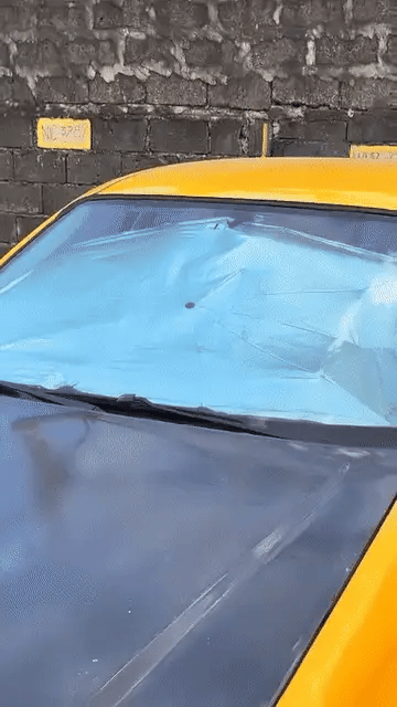 Portable Denx Car Umbrella by My Store, shown set up over a vehicle to protect against sun and rain in outdoor parking.