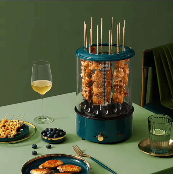 Electric rotating grill by Bazaar E Arab with adjustable heat control and stainless steel construction for even cooking.